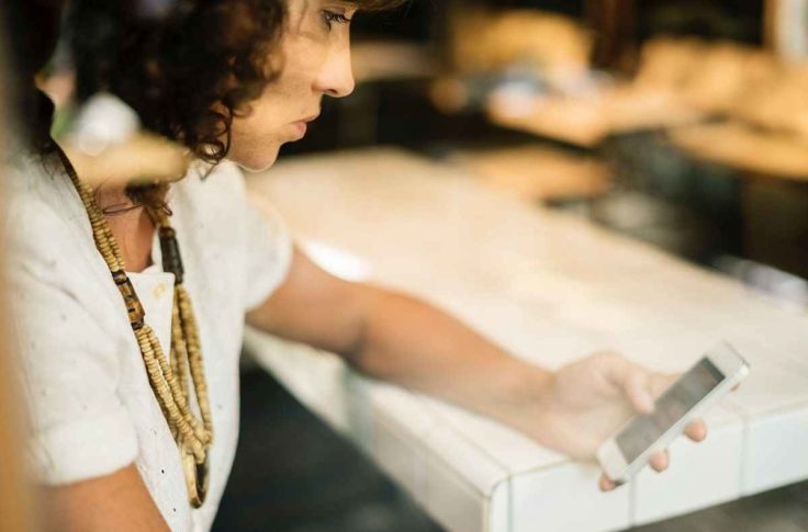 woman interacting smartphone