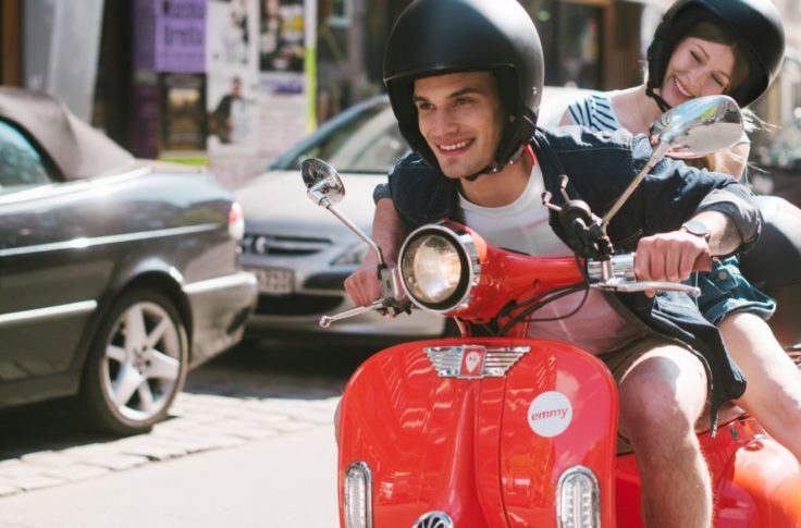 couple riding emmy scooter