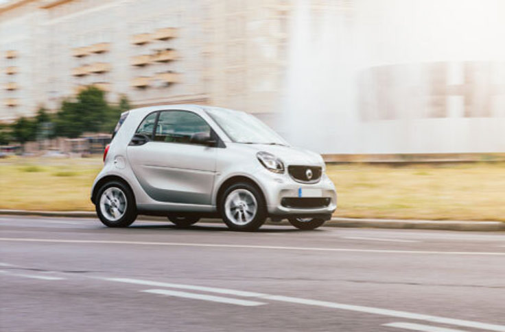 a small car an urban street