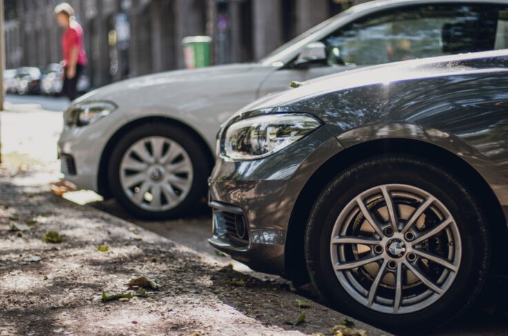 a fleet of connected cars for car sharing, parked and ready for rentals
