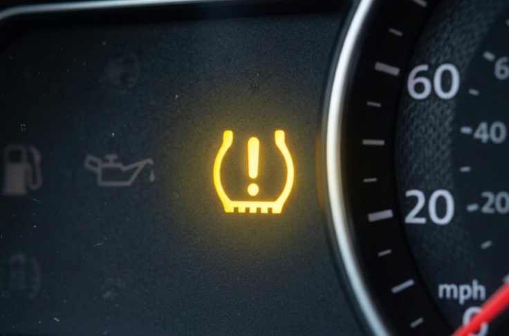 An active warning light on a dashboard