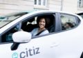 smiling woman driving a citiz car