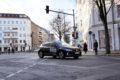 a miles car crosses a junction. on the car a slogan says 