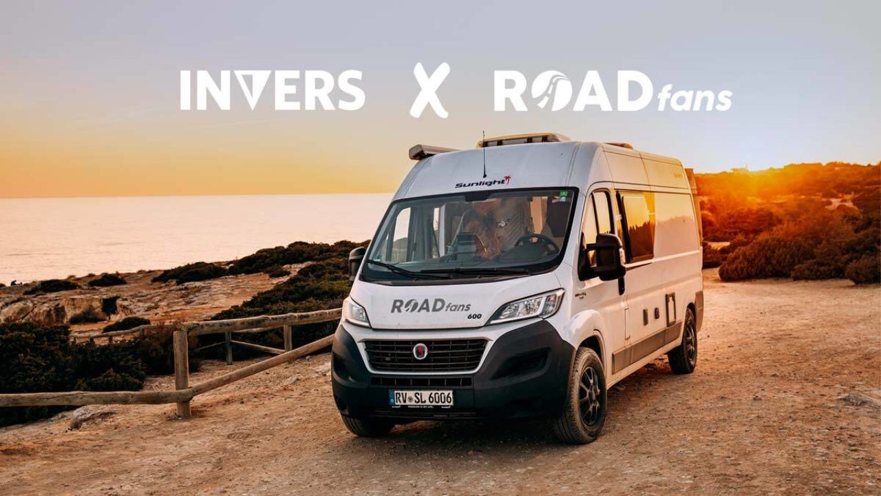 a shared roadfans campervan parked on a hill during sunset. on the top a title says "INVERS x Roadfans."