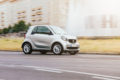 a small car on an urban street